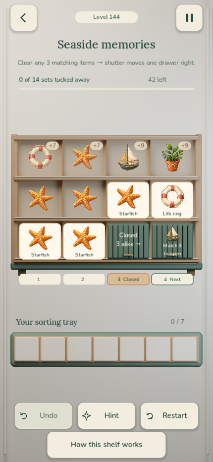 Pocket Shelves gameplay: a wooden cabinet of seaside objects, a moving shutter, and a tray of matching items.